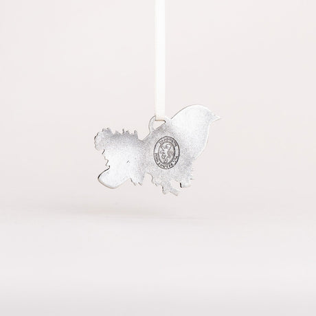 the backside of the Bluebird ornament showing the pewter material and Danforth Pewter maker's seal