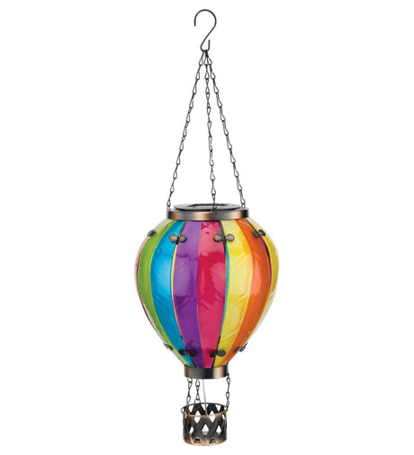 Colorful hot air balloon-shaped solar light with a metal basket, isolated on a white background.