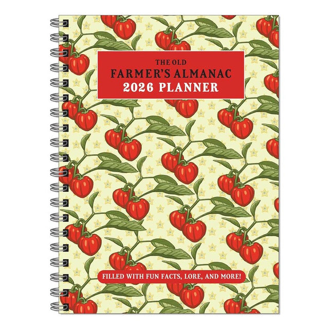 The Old Farmer's Almanac 2026 spiral bound planner notebook with repeated tomato on the vine illustration on a light yellow cover against a white background