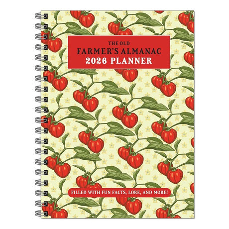 The Old Farmer's Almanac 2026 spiral bound planner notebook with repeated tomato on the vine illustration on a light yellow cover against a white background