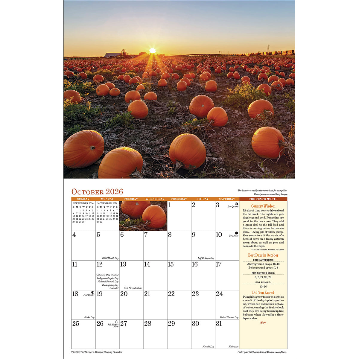 the interior page of the 2026 Country calendar open to the October page featuring a photo of a pumpkin field as the sun sets over the farm
