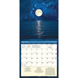 the 2026 Moon calendar open to the ay page featuring a photo of a bright full moon over a calm ocean - the moon's light is reflected onto the billowing clouds around it and onto the ocean water below