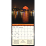 interior page of the 2026 Moon calendar featuring an image of the full moon's orange glow rising above the skyline of Istanbul, Turkey, with the moon and city lights reflected in the water