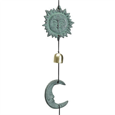 close up of the sun and moon wind chime featuring the charming, serene detail of the sun and crescent moon faces