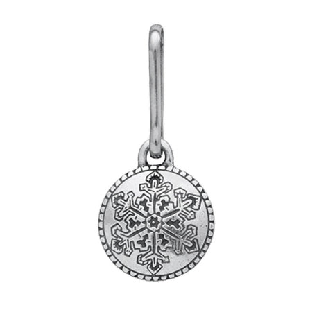 a handcrafted pewter zipper pull with a circular shape and detailed snowflake design engraved in the center