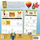 Calendar with various elements including a hot air balloon, maple syrup bottle, and lobster on a blue background.