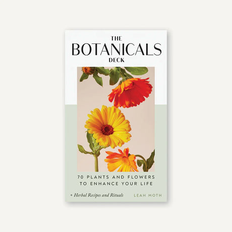 Card deck titled 'The Botanicals Deck' with floral design on a white background