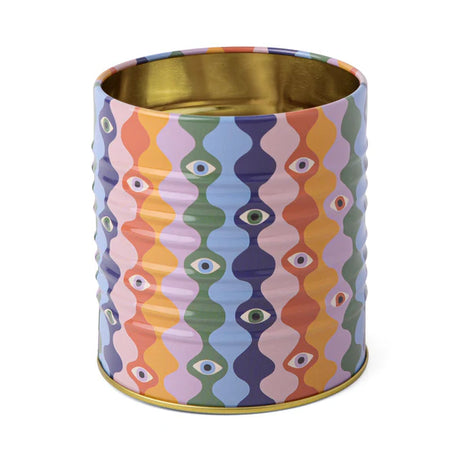 Colorful patterned container with gold interior on a white background