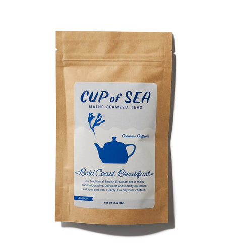 a kraft tea package with a white and blue label that reads "Cup of Sea - Maine Seaweed Teas - Bold Coast Breakfast" with a graphic of a solid blue tea kettle with seaweed shaped steam rising out of the spout