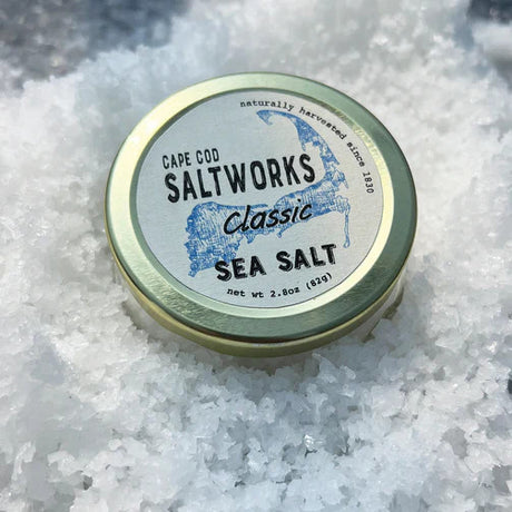 a jar of classic sea salt nestled in a layer of fresh salt