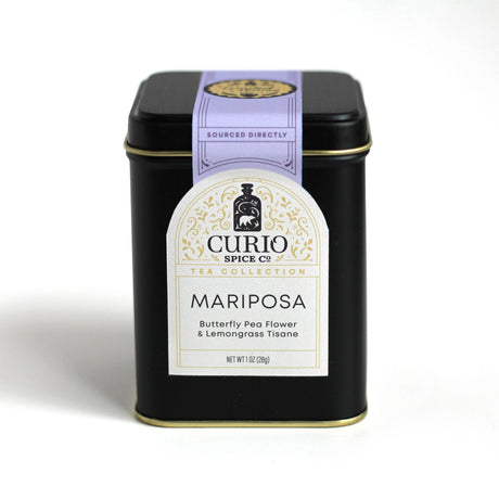 the black tea tin for the Mariposa tea with elegant off white label and purple seal
