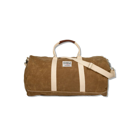 a brown waxed canvas duffle bag with white straps and leather handles against a white background