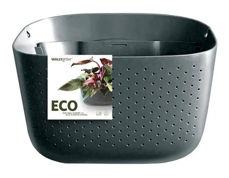 a plastic wall planter in charcoal gray with packaging affixed to the front that reads ECO and has an image of the planter filled with plants