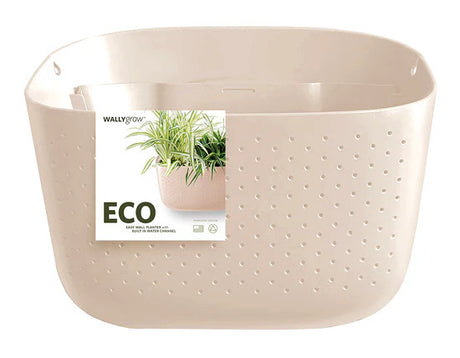 a plastic wall planter in oat with packaging affixed to the front that reads ECO and has an image of the planter filled with plants
