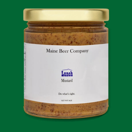 a jar of Maine Beer company Lunch Mustard in glass jar with gold lid
