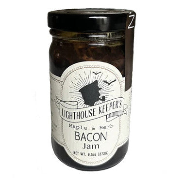 a jar of maple and herb bacon jam with a white label with a logo of a silhoutted man in a captain's hat smoking a pipe with seagulls flying behind him