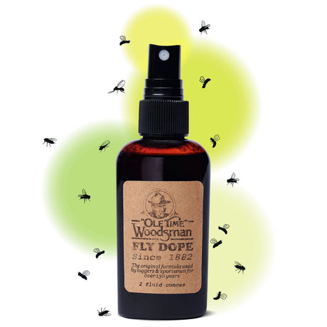 a bottle of ole time woodsman fly dope against a white background with illustrations of black flies around the bottle