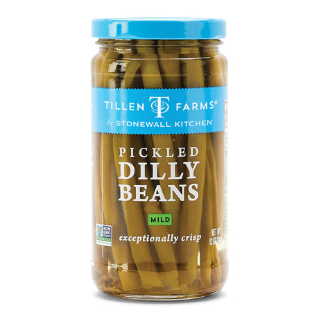 a tall narrow jar filled with pickled green beans with a sky blue jar lid