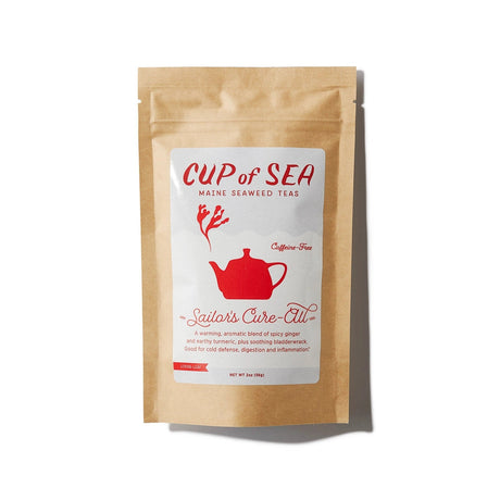 a kraft tea package with a white and red label that reads "Cup of Sea - Maine Seaweed Teas - Sailor's Cure-All" with a graphic of a solid red tea kettle with seaweed shaped steam rising out of the spout