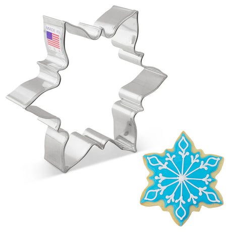 Close-up of Icy Snowflake Cookie Cutter. The metal cutter is shaped like an intricate snowflake with six points, designed for baking beautifully detailed holiday cookies.