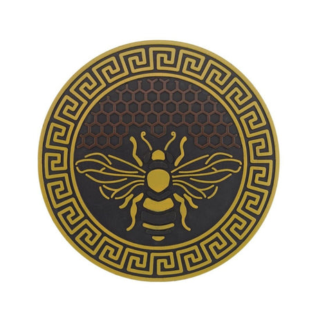 garden stepping stone with bee design and honeycomb background in yellow and brown