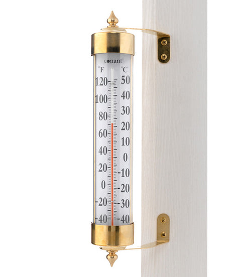 a close up of  A Brass and reliable thermostat telling you the degrees and celsius of that day.