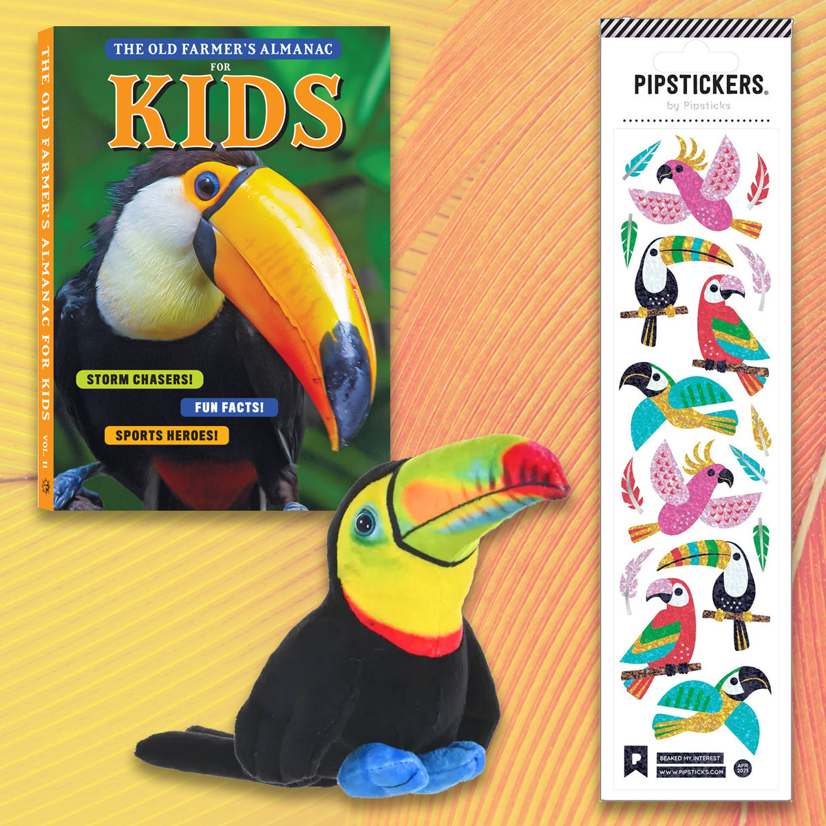 Book titled 'The Old Farmer's Almanac for Kids' with a plush toucan toy and PipStickers sheet on a colorful background.