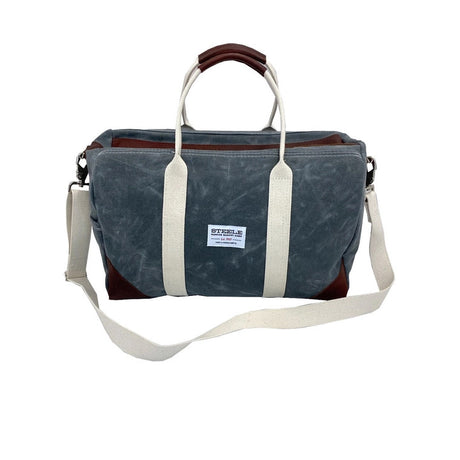 a frontal view of the waxed briquette canvas weekender bag