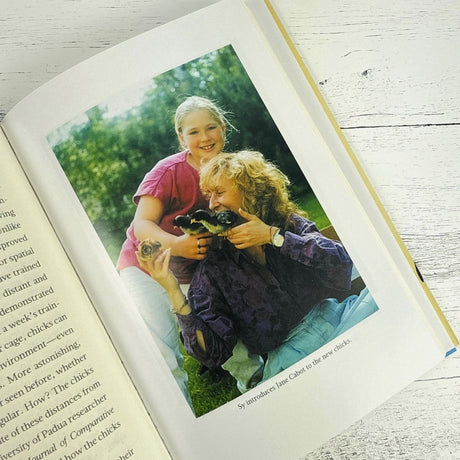 interior page of the book showing the author and a young girl holding chicks