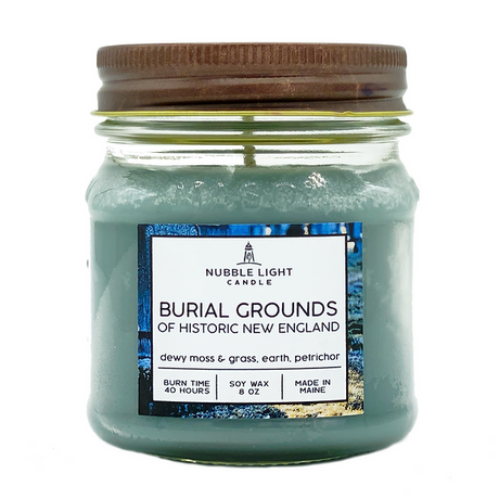 Jar of Nubble Light Candle labeled 'Burial Grounds of Historic New England' on a white background